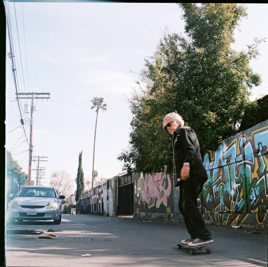 A photograph of Steve Olson skateboarding.