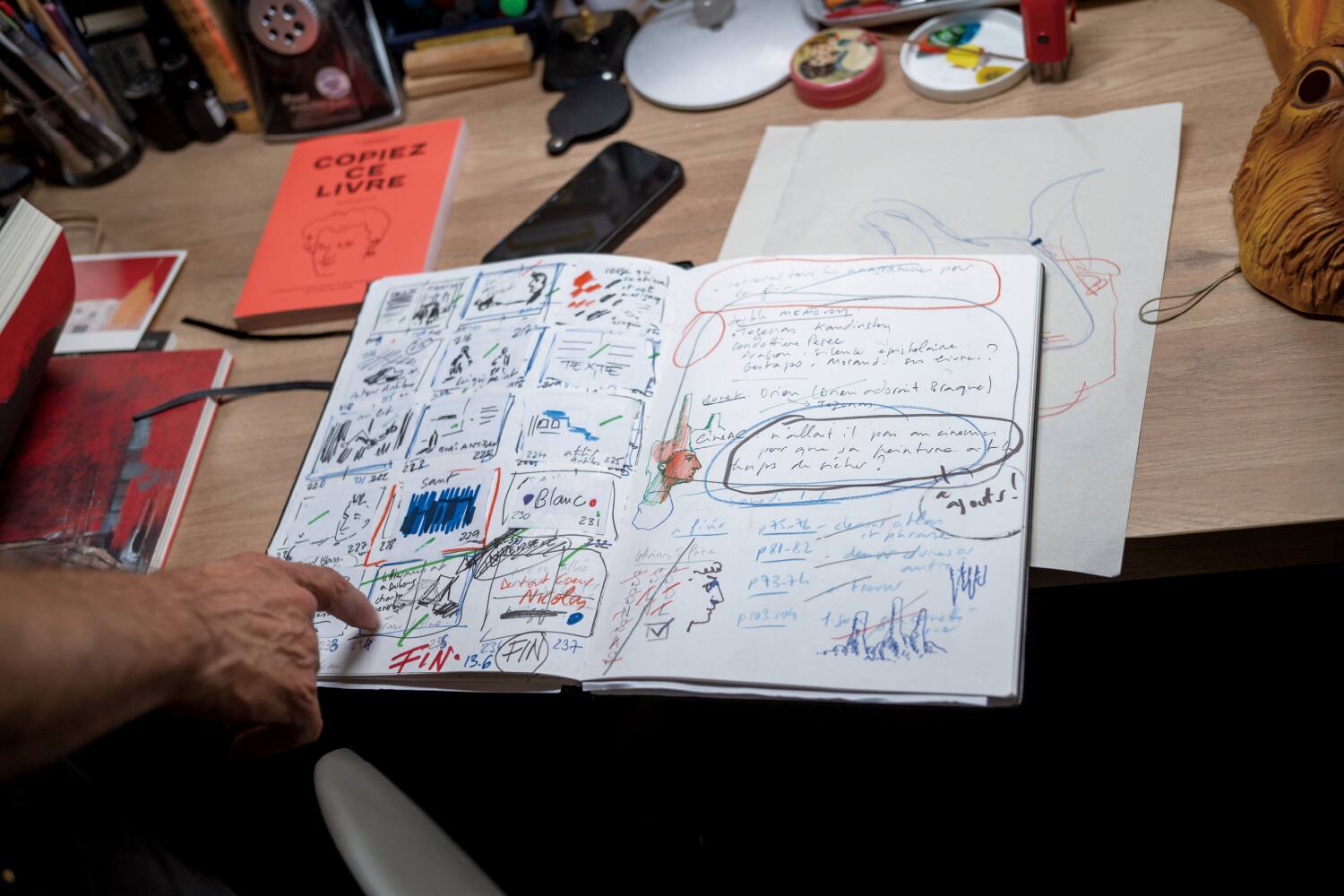 Stéphane Manel holding design materials