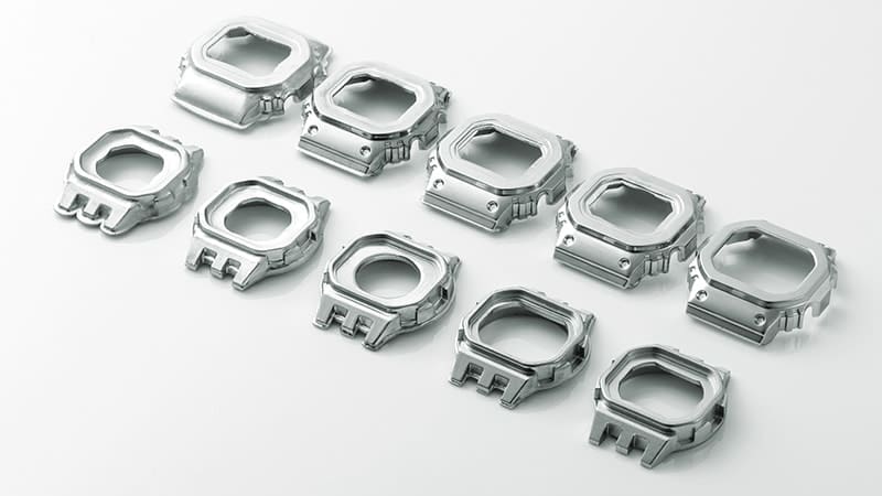 Ten silver-coloured bezels in different manufacturing states – from blanks to finished bezels