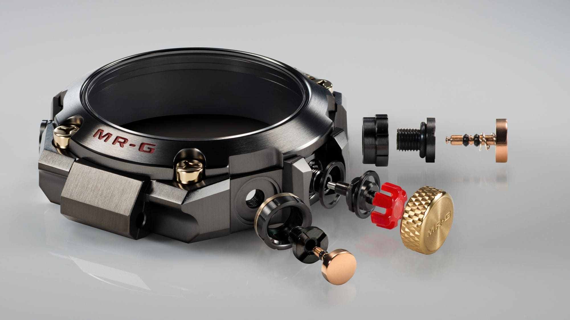 The bezel of the MRG-B2000B-1A4 taken apart into its individual parts