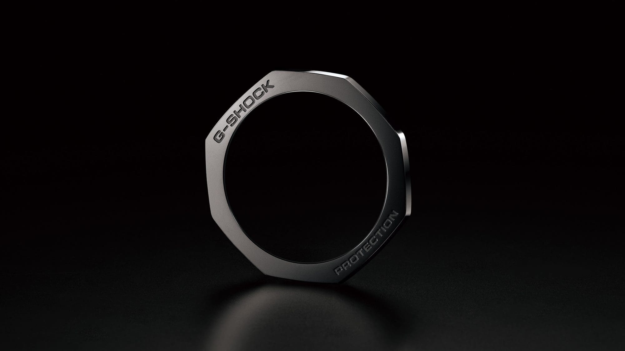 The shiny black bezel against a black background