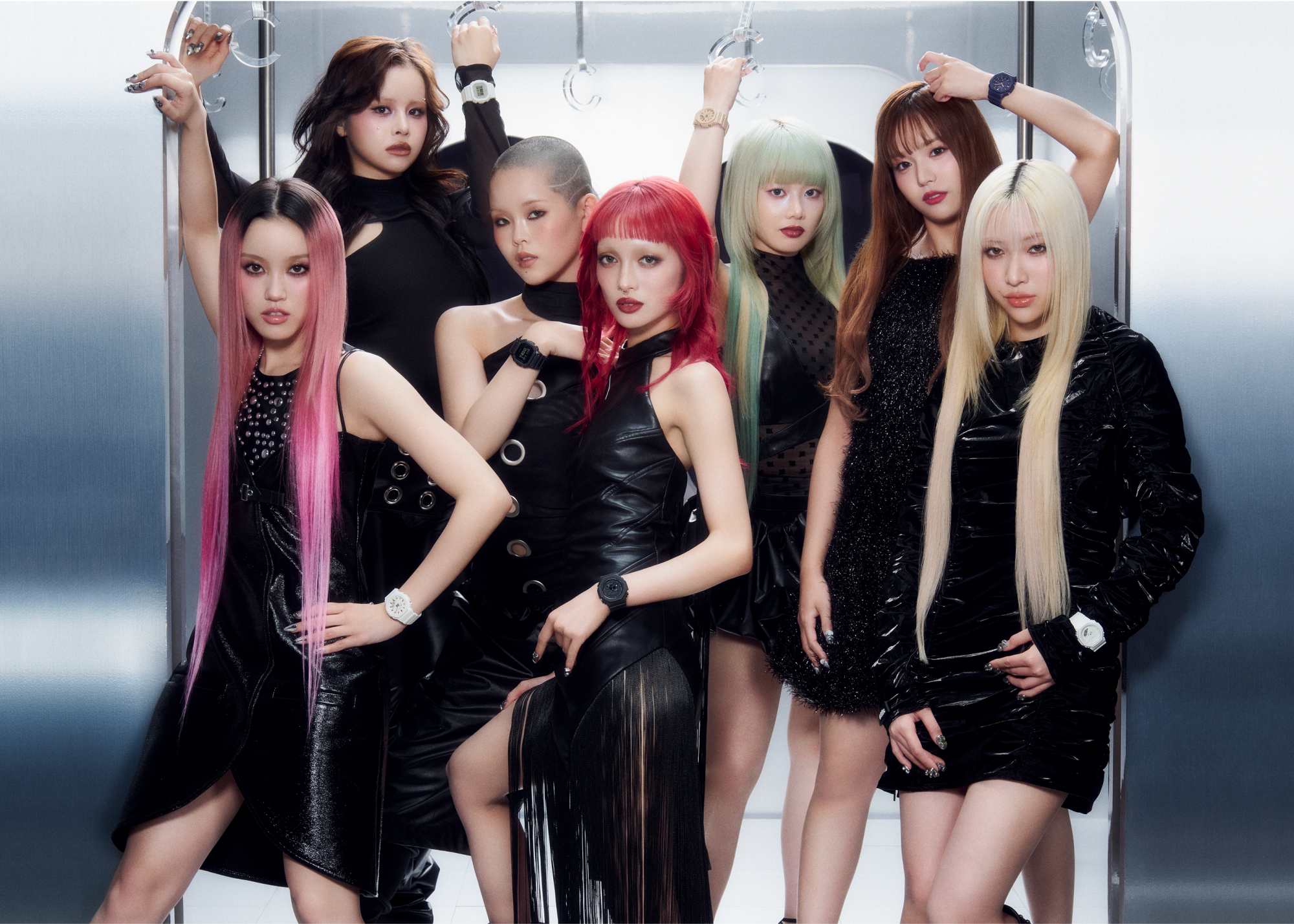 A photo of XG members wearing G-SHOCK and black clothes in a train.