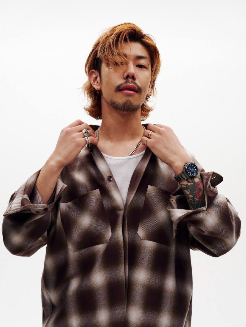 A male is wearing G-SHOCK GST-B1000BD-2A on his wrist.
