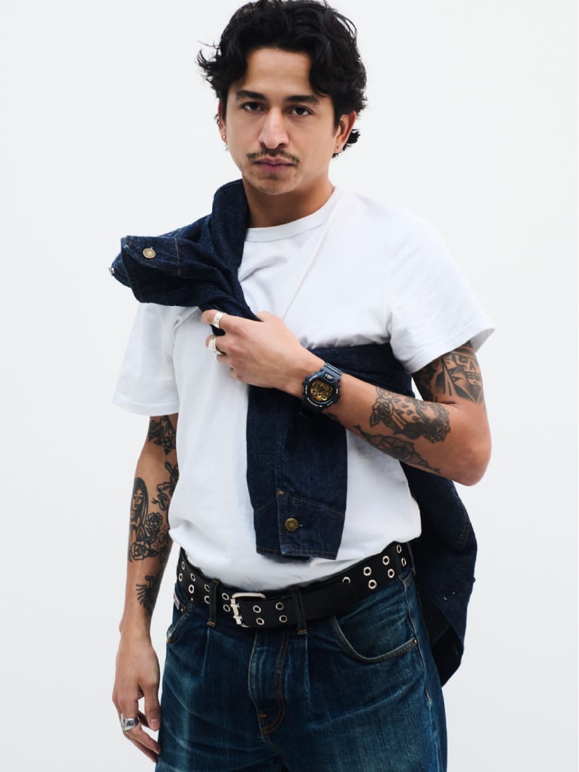 A male is wearing G-SHOCK DW-6900CF-1 on his wrist.