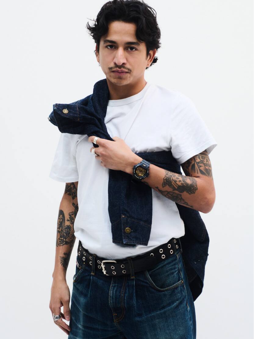 A male is wearing G-SHOCK DW-6900CF-1 on his wrist.