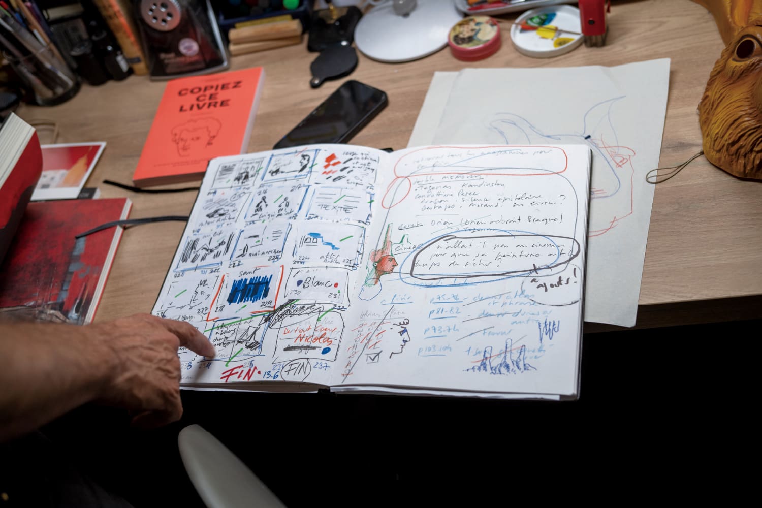 Stéphane Manel holding design materials