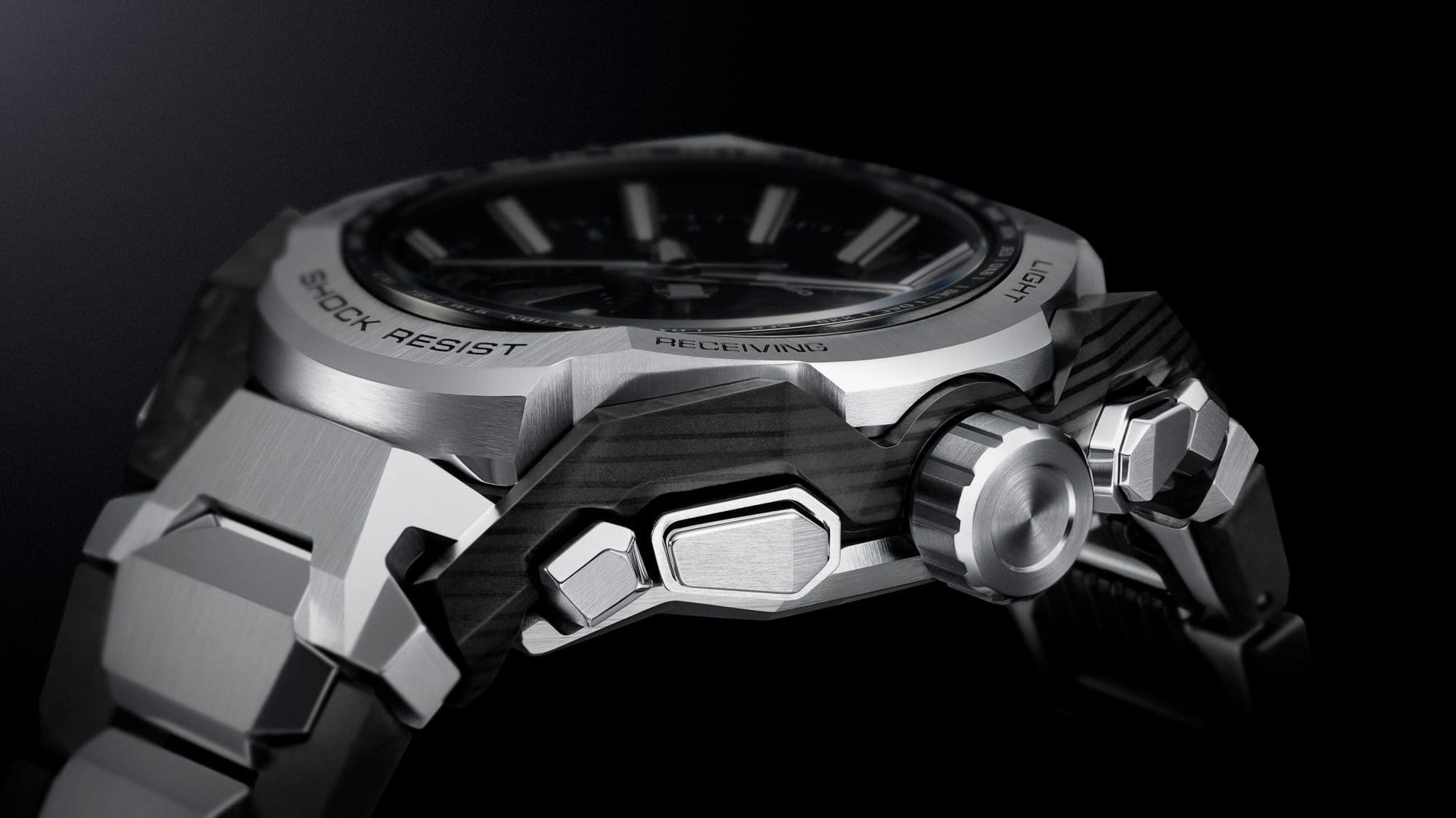 Close-up image of a watch featuring a carbon fiber layered frame