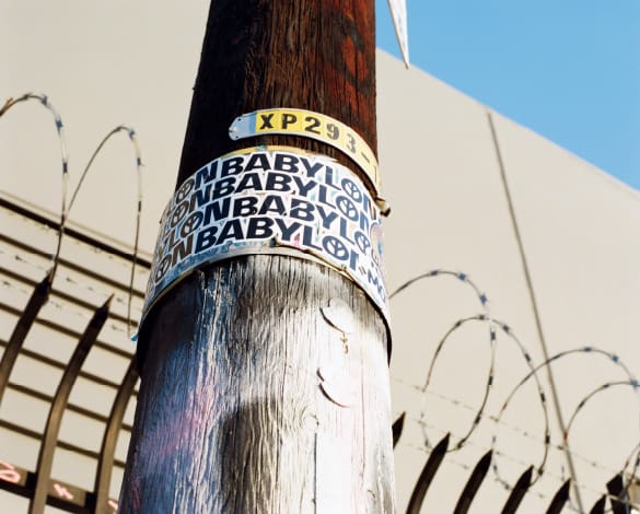 Foto tiang listrik dengan stiker Babel di atasnya