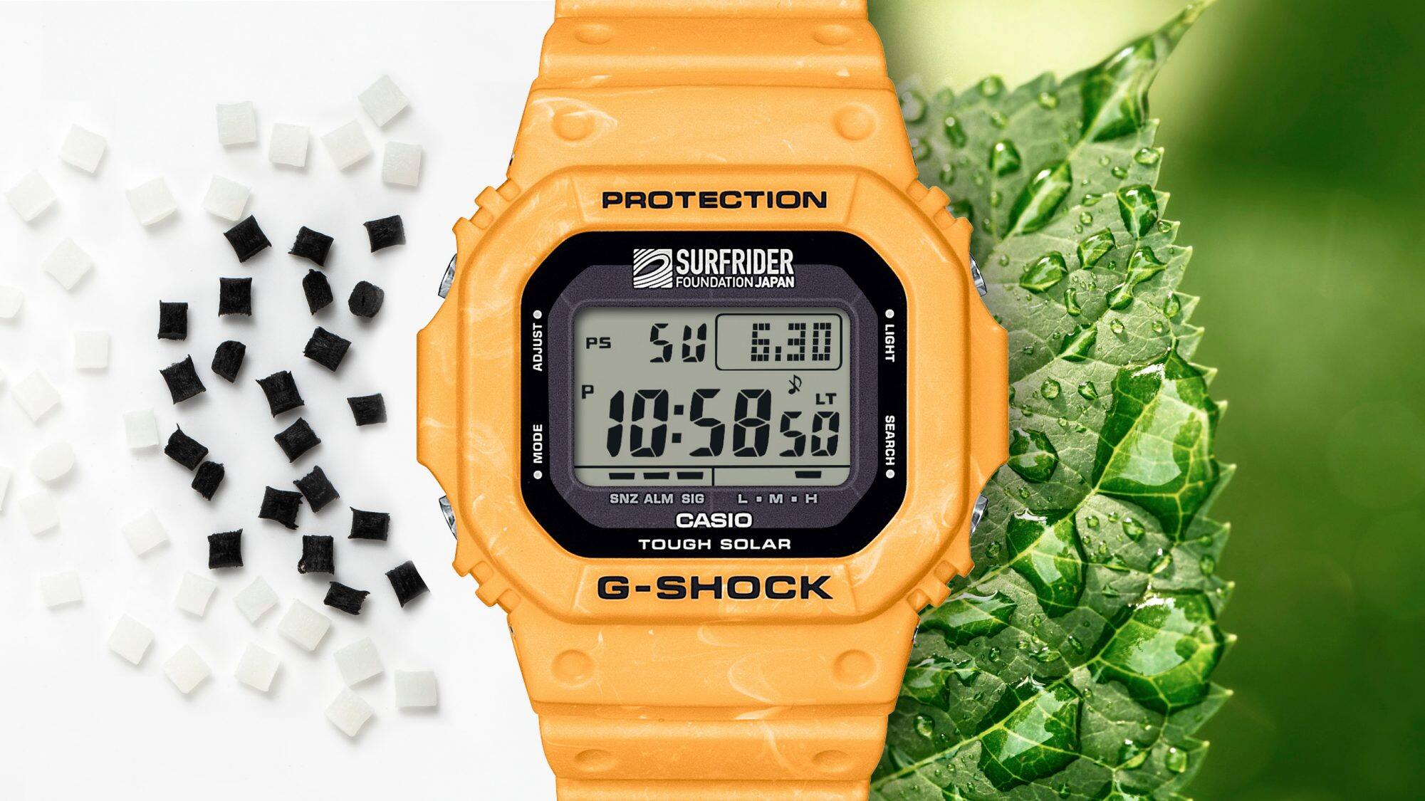 L'orologio digitale giallo G-5600SFJ accanto a pellet di resina e a una foglia verde che simboleggia la resina bio-based