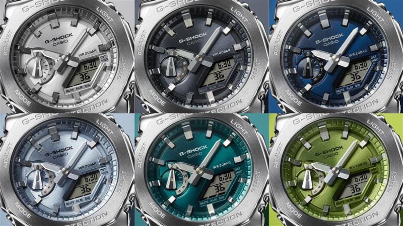 Seis variantes de cores da série Casio G-Shock GM-2110D lado a lado: o relógio de pulso GM-2110D-7A com mostrador prateado, um com mostrador cinza-azulado ao lado do GM-S2110 com mostrador azul escuro, um mostrador azul claro, o relógio com mostrador turquesa e o relógio de metal com mostrador verde.