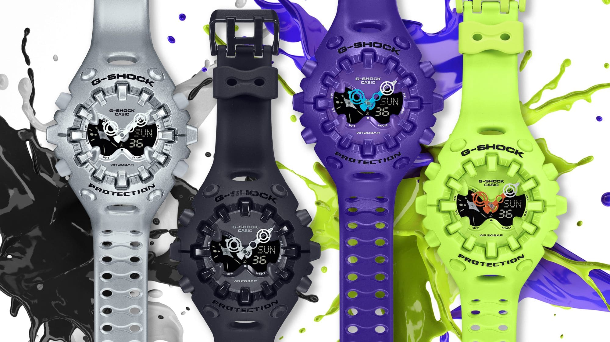 Quatro modelos de relógios “GA-V01” com uma grande caixa redonda e volumosa e um mostrador analógico em amarelo néon, preto, prateado e roxo.